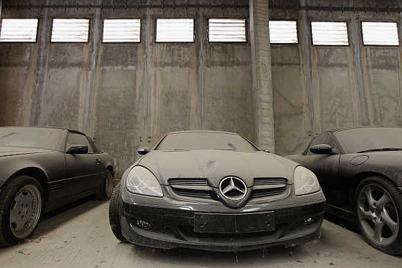 Confiscated luxury cars inside a warehouse of Oddy in Athens.