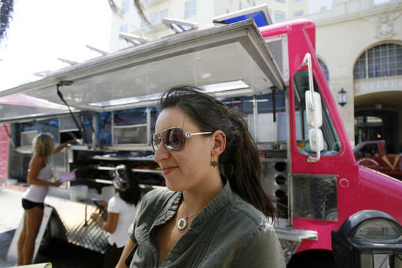 Michelle Madrid waits for her burger in Hollywood, California.