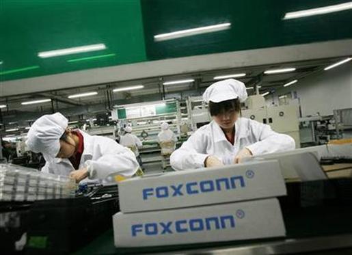 Employees work inside a Foxconn factory.