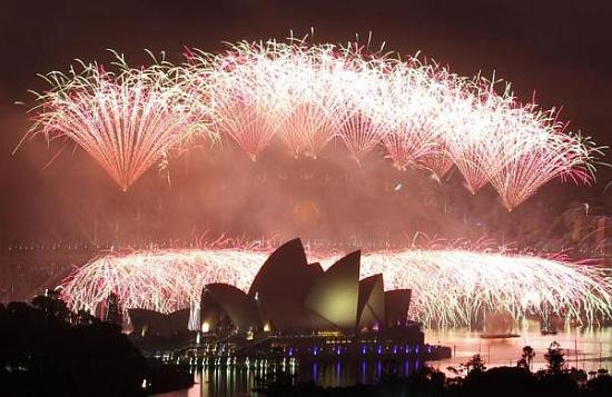 Fireworks explode over the Sydney Harbour Bridge and Opera House during a pyrotechnic show to celebrate the New Year.