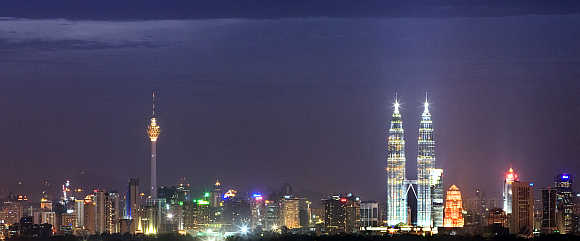 Malaysia's landmark Petronas Twin Towers stand tall in the heart of the capital Kuala Lumpur.