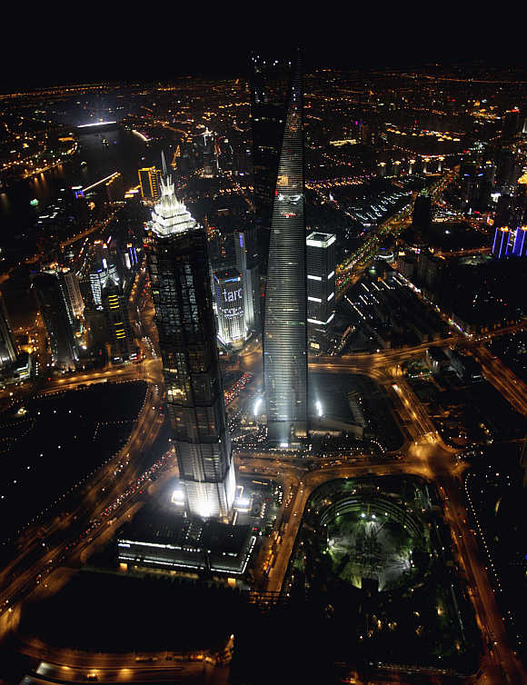A view of the Jin Mao Tower, left, and Shanghai World Financial Centre, right, in Shanghai.