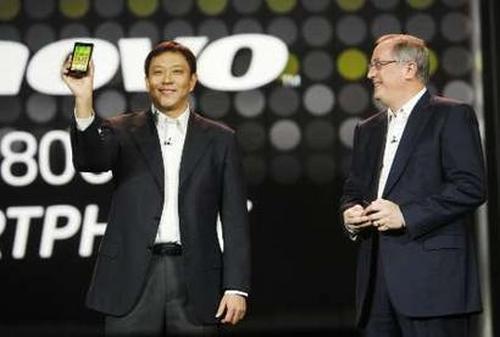 Liu Jun, president (business group) of Lenovo, shows K800 smartphone.
