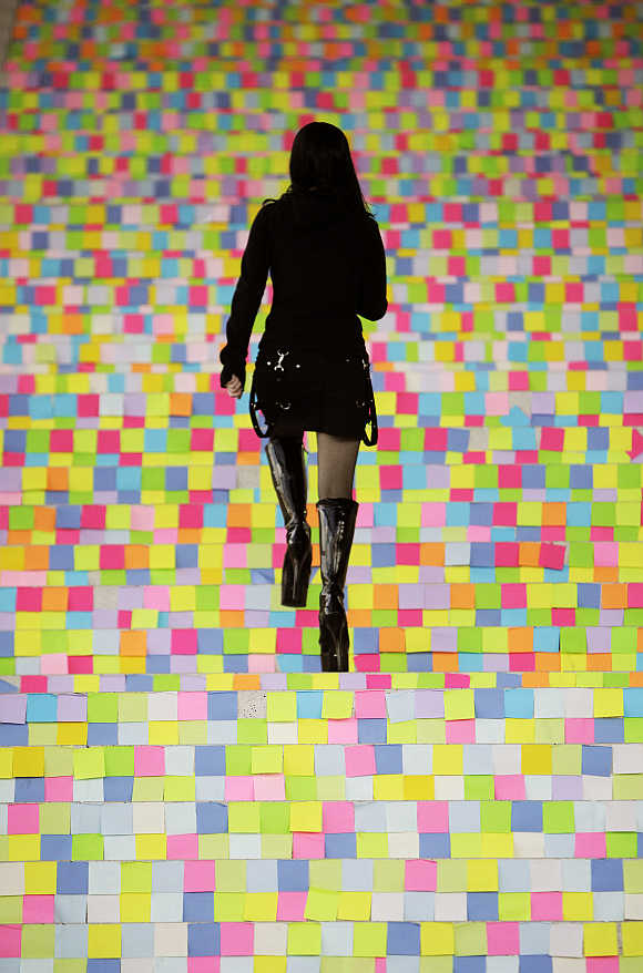 A girl walks upstairs at the CeBIT computer fair in Hanover, Germany.