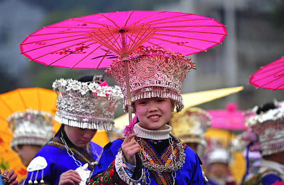 An ethnic Miao woman wearing her traditional headwear made of silver on the Miao's New Year's day in Leishan county, southeast Guizhou province, China.