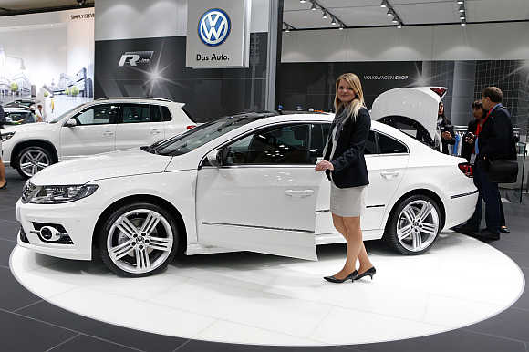 A model poses next to a Volkswagen CC R-line in Leipzig, Germany. Photo is for representation purpose only.
