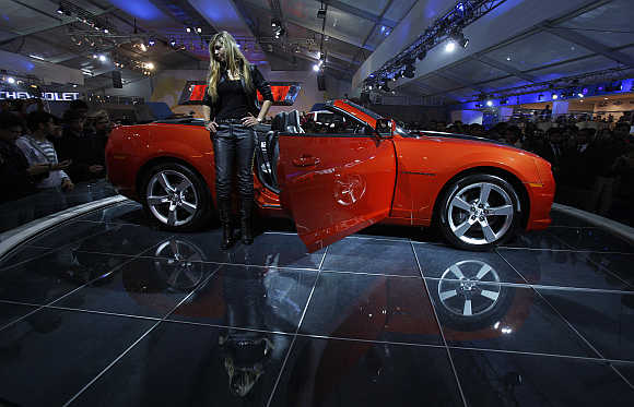 A model stands beside a General Motors Chevrolet Camaro car during India's Auto Expo in New Delhi. Photo is for representation purpose only.