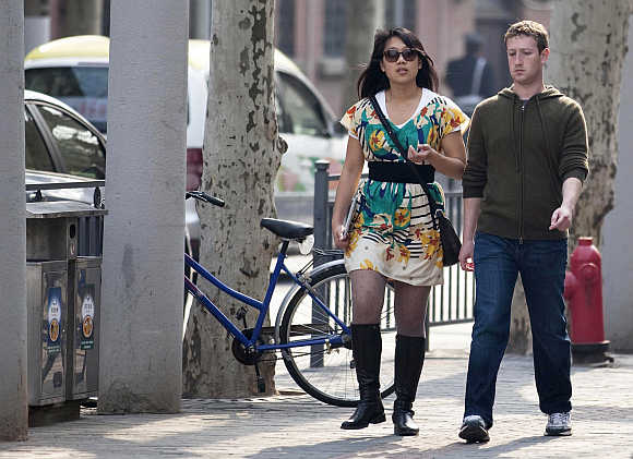 Mark Zuckerberg with his wife Priscilla Chan on Fuxing Road in Shanghai.