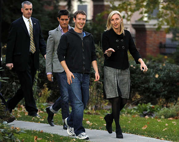 Mark Zuckerberg walks out to speak to reporters at Harvard University in Cambridge, Massachusetts.