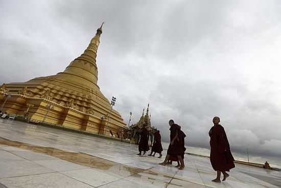 Buddhist monks visit the Uppatasanti pagoda in Myanmar. As the country moves away from authoritarian rule it may not give preference Indian companies.