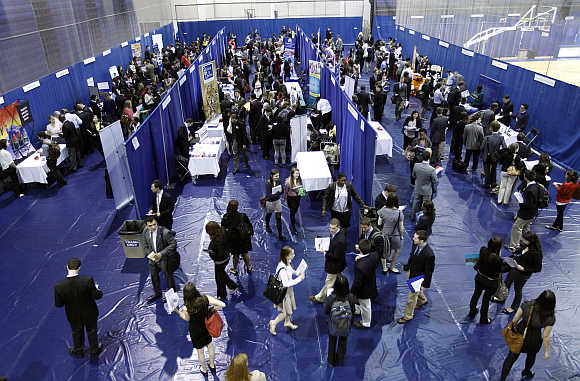American University students walk among recruiting booths during a career job fair at American University in Washington, DC.