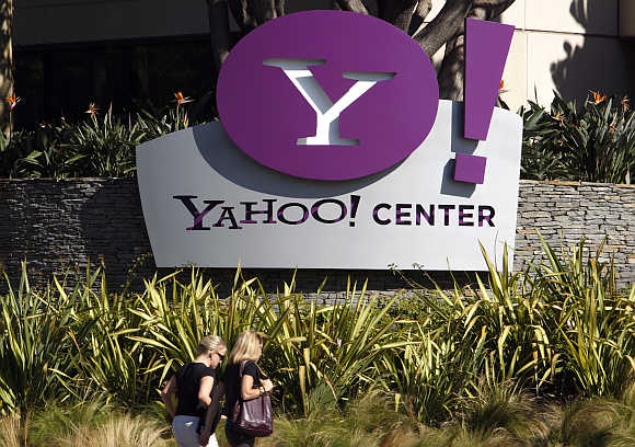 Women walk past Yahoo office in Santa Monica, California.