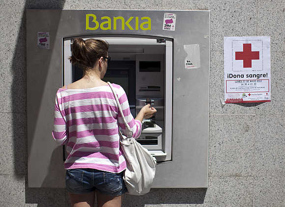A woman at an ATM in Madrid, Spain.
