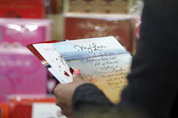 A woman chooses a card for the Valentine's Day in Kathmandu.