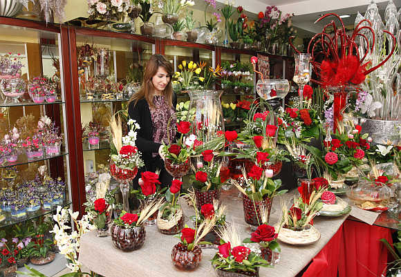 A woman waits to buy flowers on Valentine's Day in Amman, Jordan.