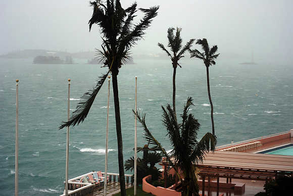 High winds and rising surf come ashore in Hamilton, Bermuda.
