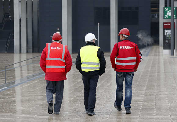 Workers at the construction site of the Berlin Brandenburg International Airport Willy Brandt in Schoenefeld, Berlin.