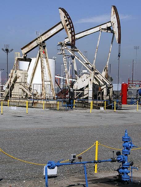 Oil is pumped from wells at the Port of Long Beach, California.