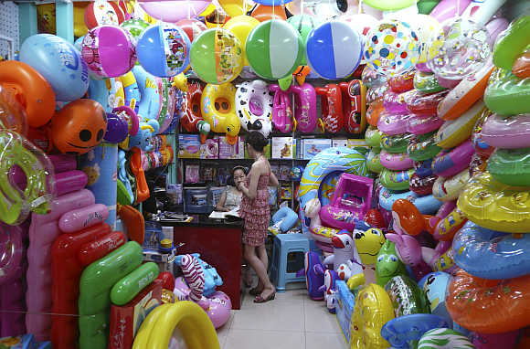 Vendors sell toy buoys at a market in Yiwu, Zhejiang province, China.