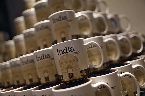 Coffee mugs featuring the India Gate war memorial are on display during the launch of the first Starbucks store in New Delhi.