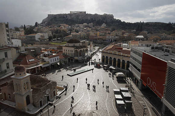 A view of the Monastiraki Square with the Acropolis hill in the background in central Athens.