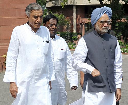 Prime Minister Manmohan Singh with Railway Minister Pawan Kumar Bansal.