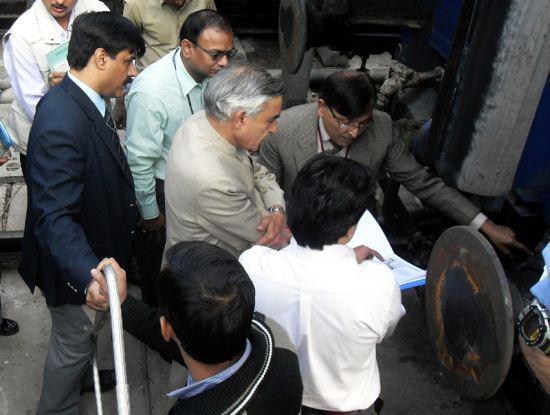 Pawan Kumar Bansal visits the New Delhi Railway station to see implementation of a new project.