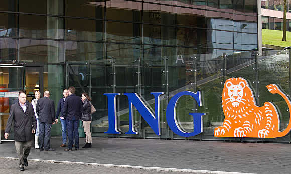 Employees of ING group take a break in front of their office in Amsterdam, the Netherlands.