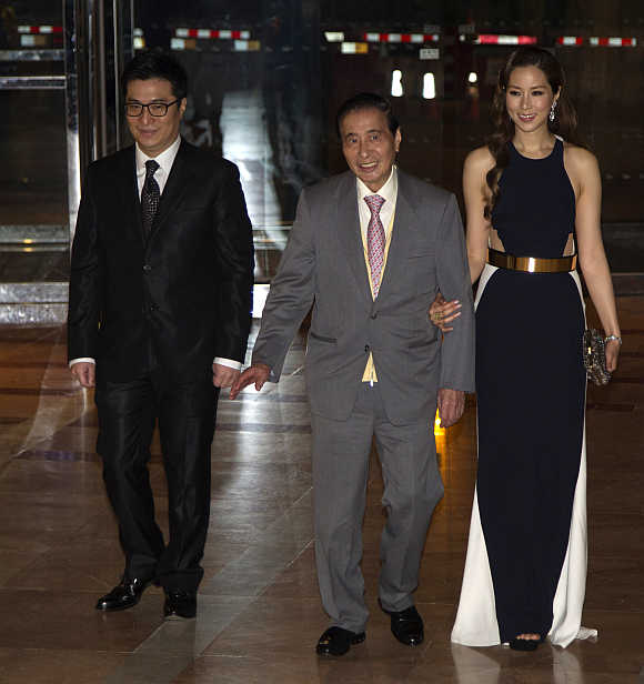 Lee Shau Kee, centre, with his son Martin Lee Ka-shing and his wife Cathy Chui in Hong Kong.