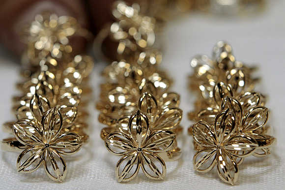 Jewellery made from gold is laid out at a factory.