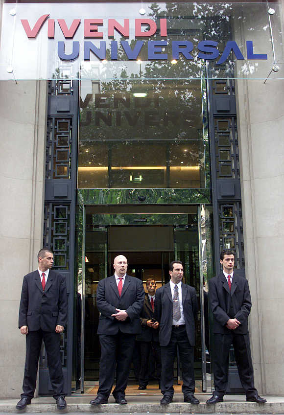 Vivendi members of security stand in front of Vivendi Universal headquarters in Paris.