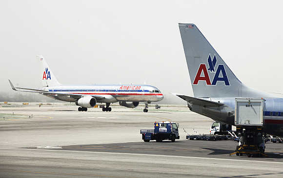 American Airlines aircraft stand on the tarmac at Los Angeles International Airport.