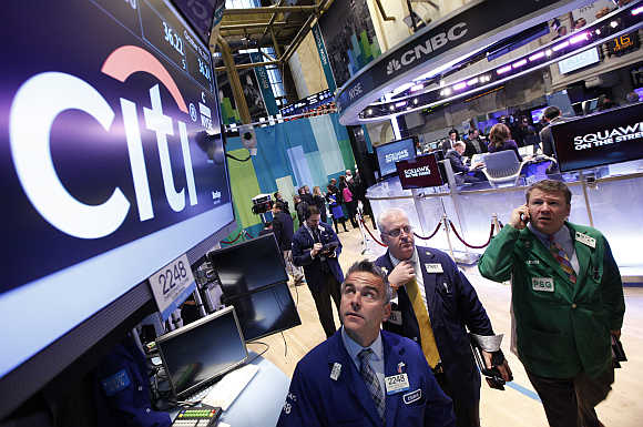 Traders at the post that trades Citigroup stock on the floor of the New York Stock Exchange.
