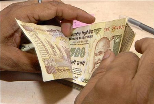 India in tight spot as rupee slides to record low