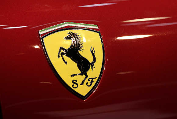 A Ferrari logo on the side of the F12 Berlinetta.
