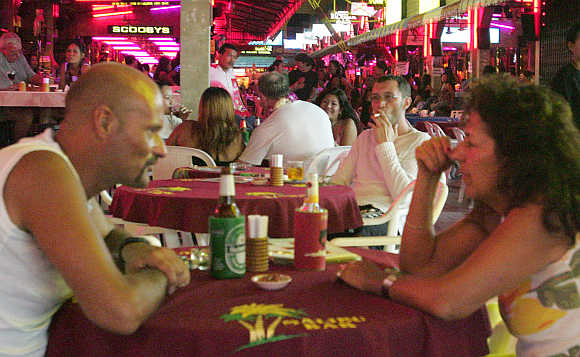 Foreign tourists in a bar in Patong Beach, Phuket.