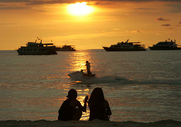 Sun sets on Patong Beach in Phuket.