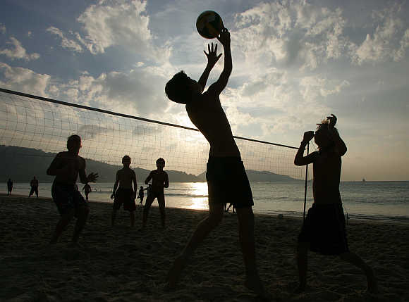 French children play volleyball on Patong Beach in Phuket.