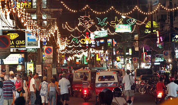 Tourists enjoy the nightlife in Phuket.