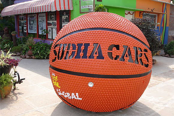 A basketball-shaped car at the museum.