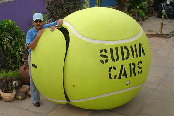 A tennis ball-shaped car in the museum.