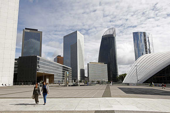 A view of French oil engineering group Technip tower, left, French group GDF Suez headquarters tower building, second right, and mobile operator SFR tower, right, at the La Defense business district, near Paris.