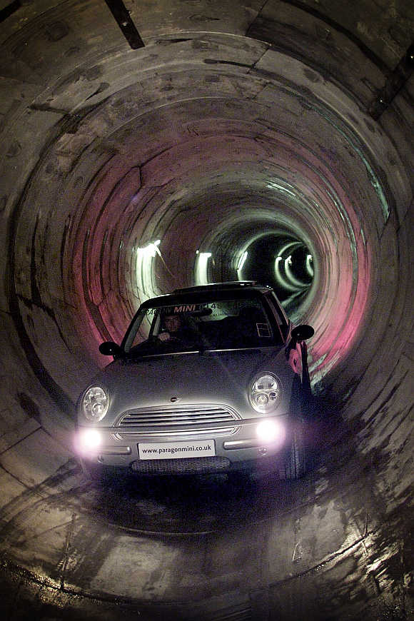 Yorkshire Water project manager Steve Tindall drives a BMW mini cooper through a sewer system under the streets of Hull, United Kingdom.