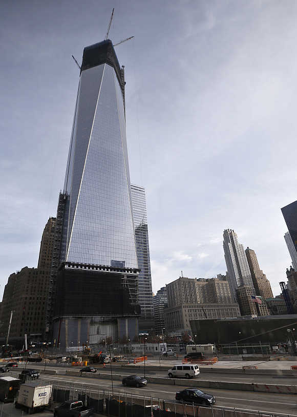 Cranes tower over One World Trade Center in New York's lower Manhattan.