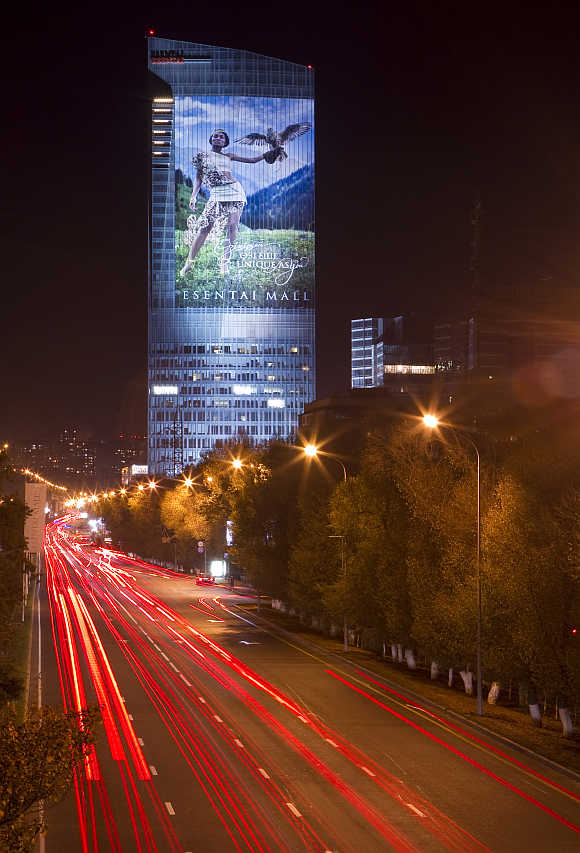 Traffic moves past Esentai Tower along Al Farabi Avenue in Almaty.