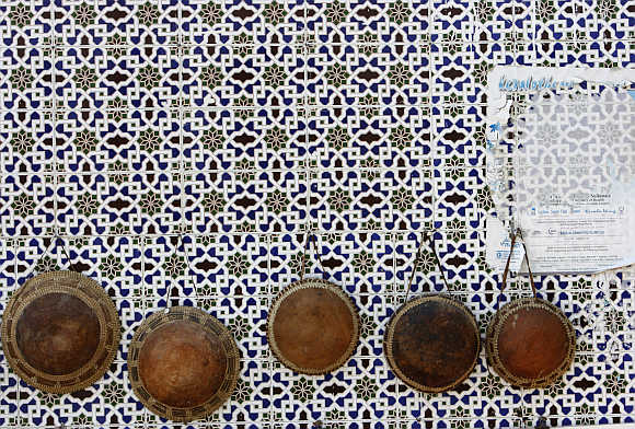 Hats are displayed on a wall in Mattrah Souq, the oldest market in Oman, in the capital Muscat.