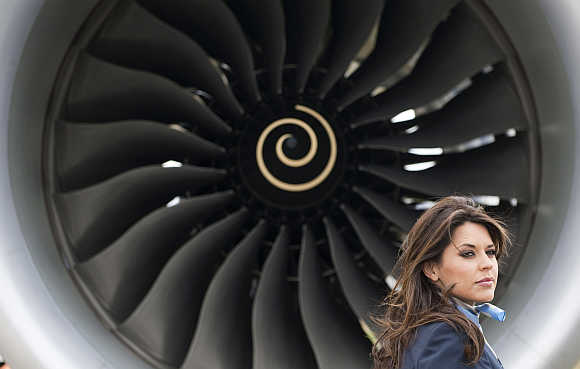 Model Daniella Lineker stands in front of the Boeing 787 Dreamliner aircraft at Farnborough airport in Farnborough, southern England.