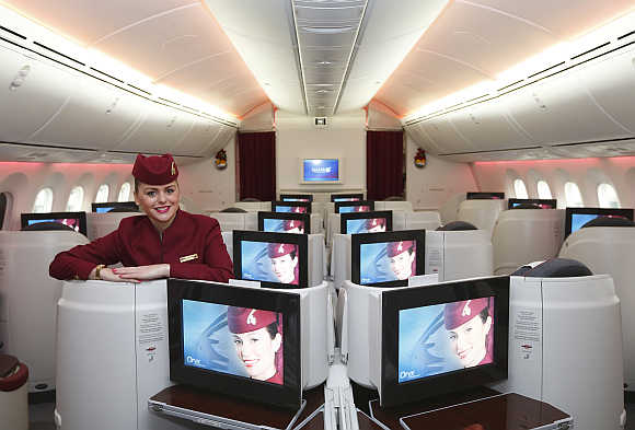 A flight attendant in the business-class cabin of the Boeing 787 Dreamliner at Heathrow Airport, west London.