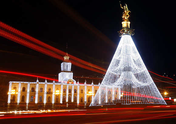 City Hall and the Freedom Monument are illuminated with Christmas decorations on the main square in Tbilisi, Georgia.