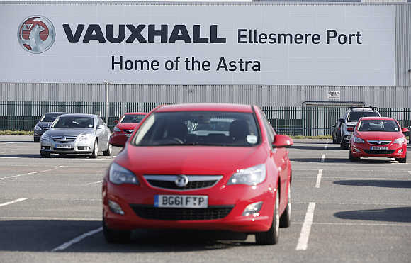 Vauxhall cars in a car park outside the company's plant in Ellesmere Port, northern England.